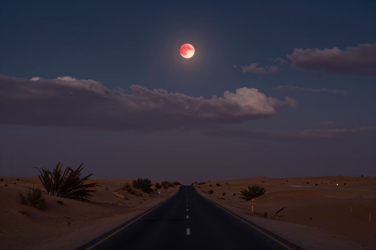 Blood Moon Over Desert Road Jeddah Winter Night in beneath thin cloud gaps and stars near Jeddah