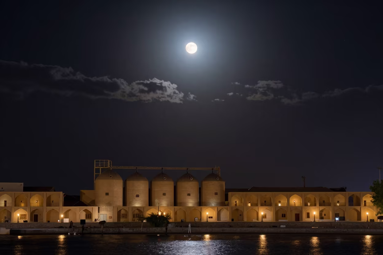 Blood Moon Over Silos By Lantern Harbor Yazd in beside a lantern-dotted harbor near Yazd