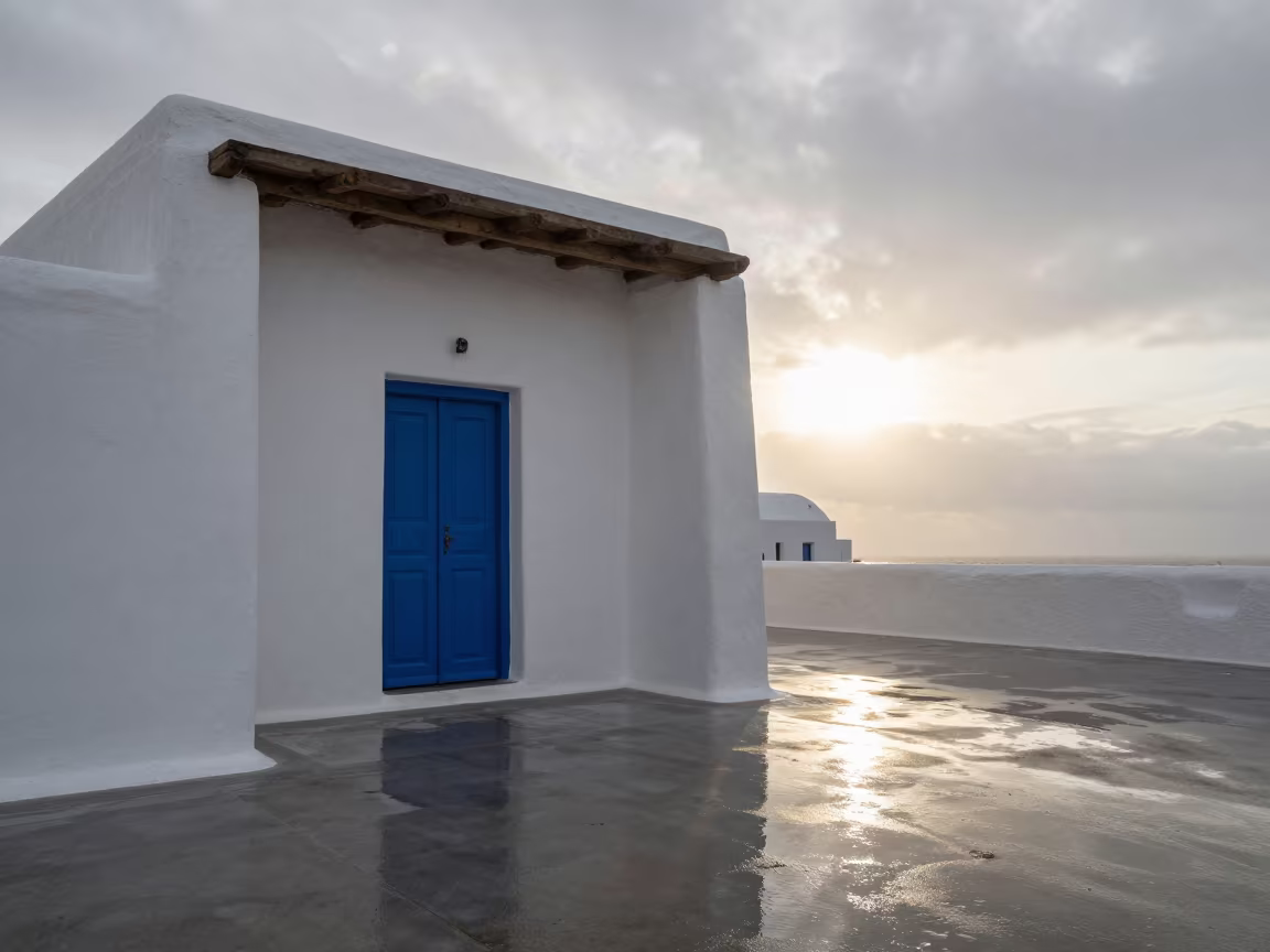 Blue Door White Cycladic House Sunset Passageway in inside a skylit passageway in Tamale