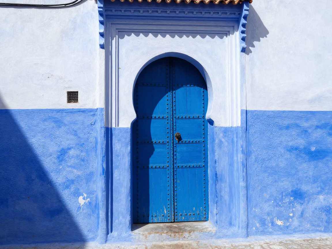 Blue Doorway in Essaouira at Bright Midmorning Light in in Essaouira, Morocco