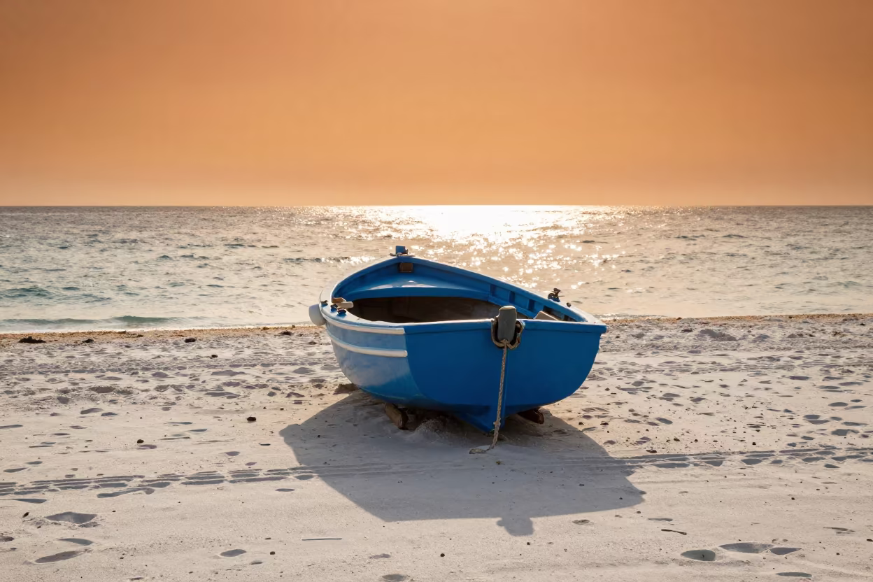 Blue Fishing Boat on White Sand at Croatian Sunset in in Croatia