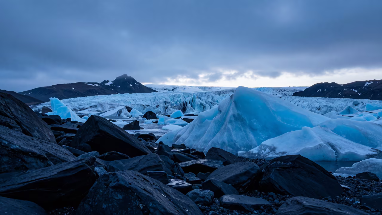 Blue Glacier Ice on Iron Rock Shoreline in along a wave-cut shoreline in Russia