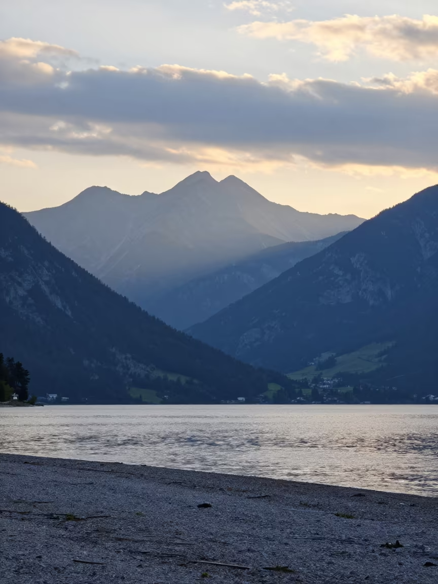 Blue Haze Over Tyrolean Ridges Before Sunrise in along a wave-cut shoreline in Tyrol