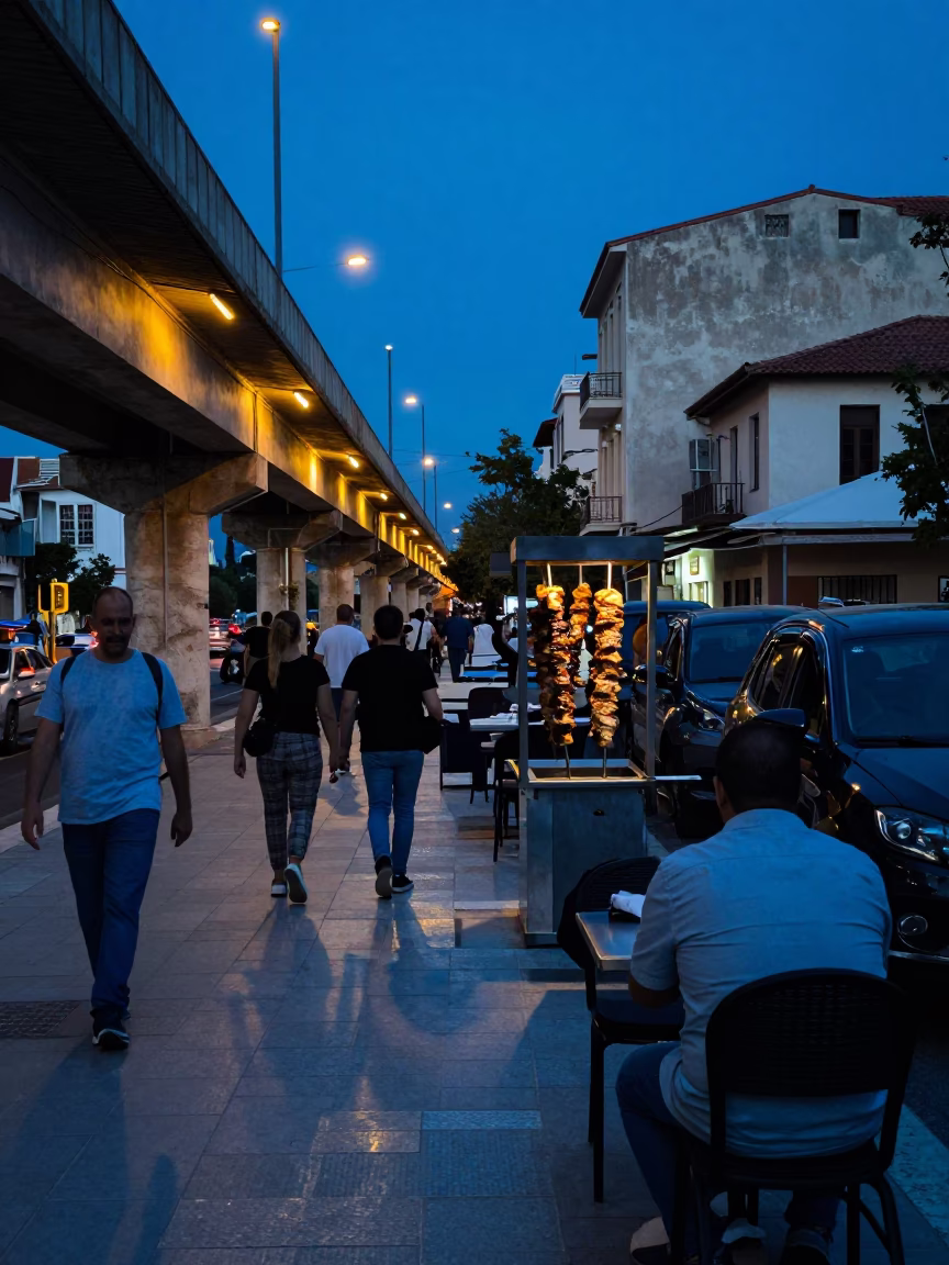 Blue Hour Athens Street Scene with Grilled Kebab and Glowing Overpass Taillights in in Athens, Greece