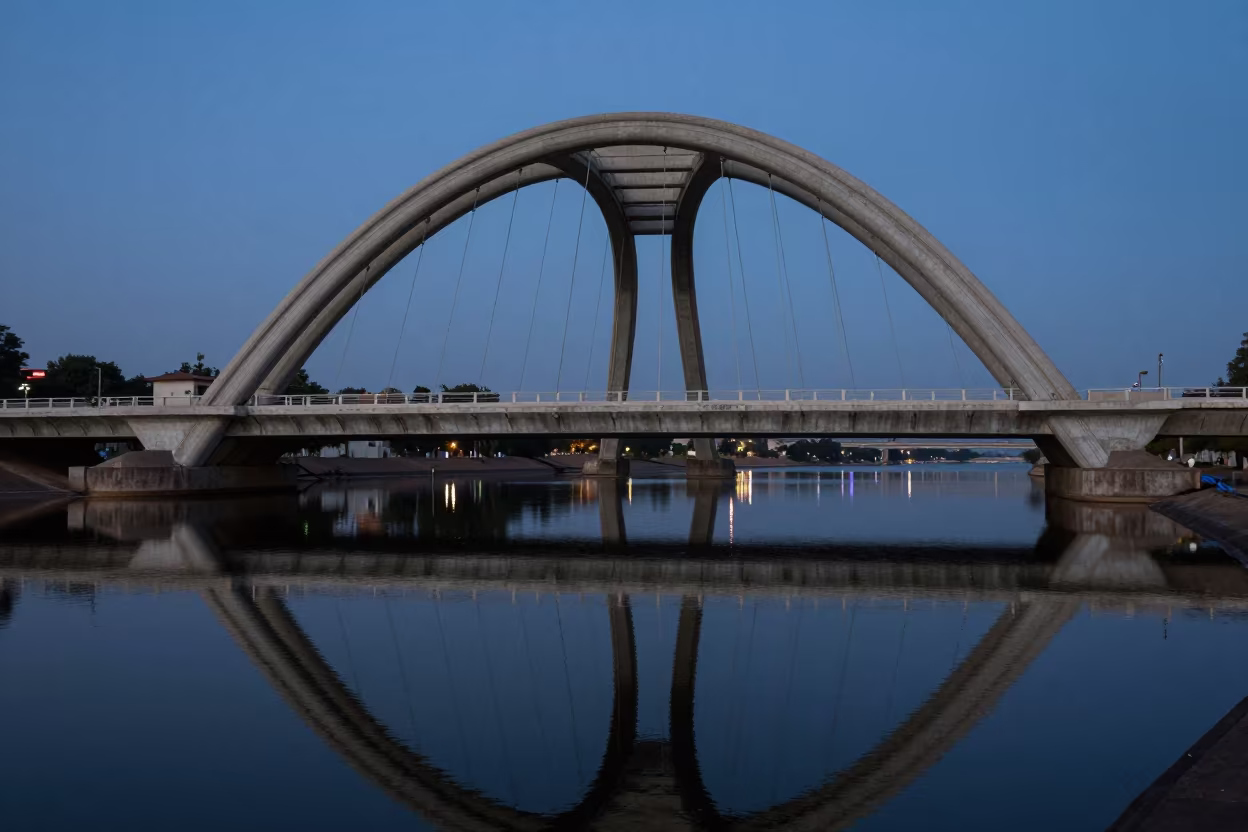 Blue Hour Bridge Arch Reflection in Khartoum in across a formal civic plaza in Khartoum