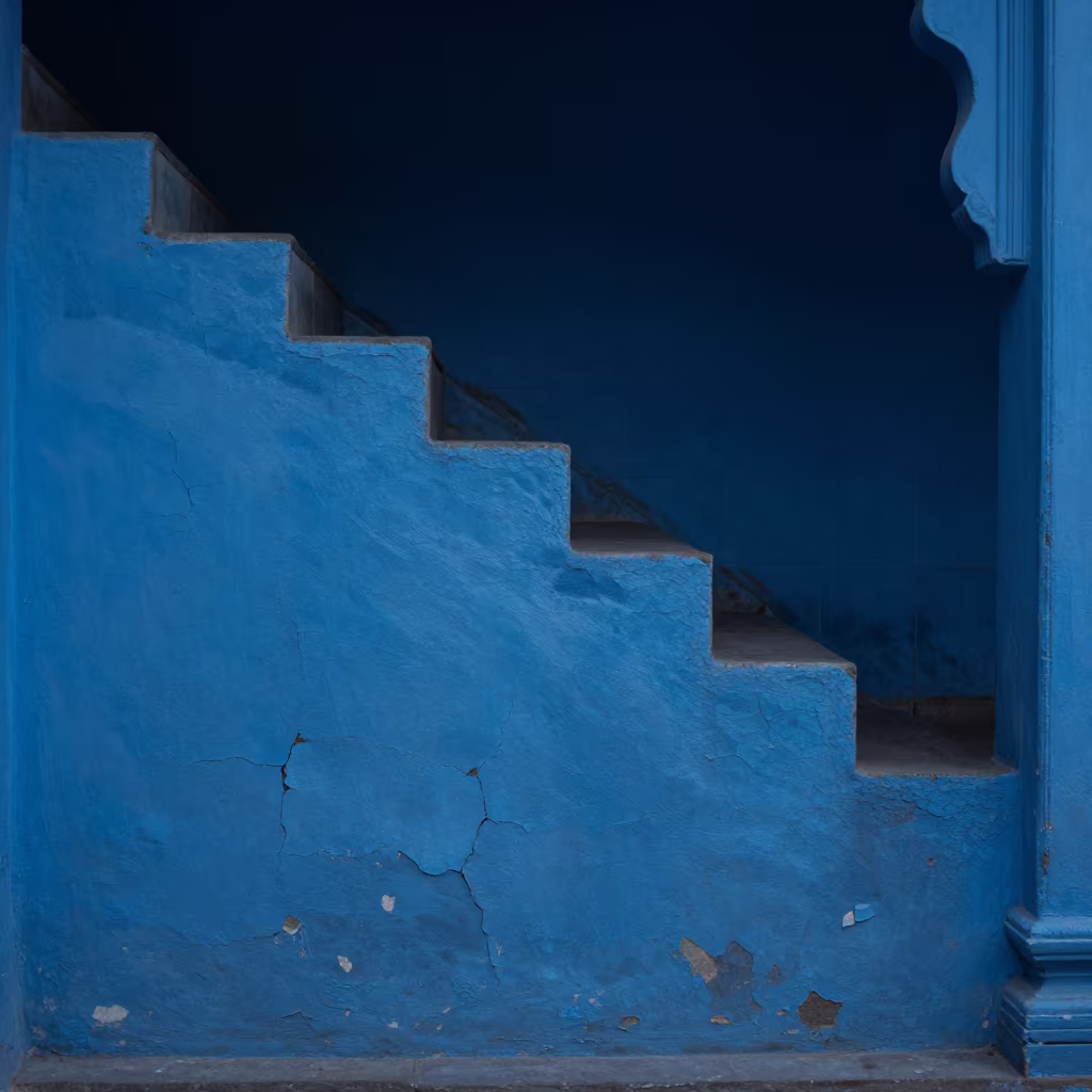 Blue Hour Crackle Pattern on Old Paint in inside a tiled stair hall in Bharuch