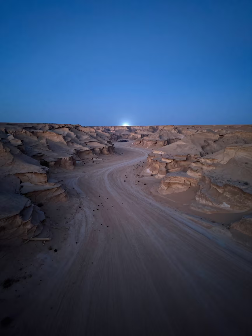 Blue Hour Desert Mirage Over Nouakchott Valley in across a wide valley floor near Nouakchott
