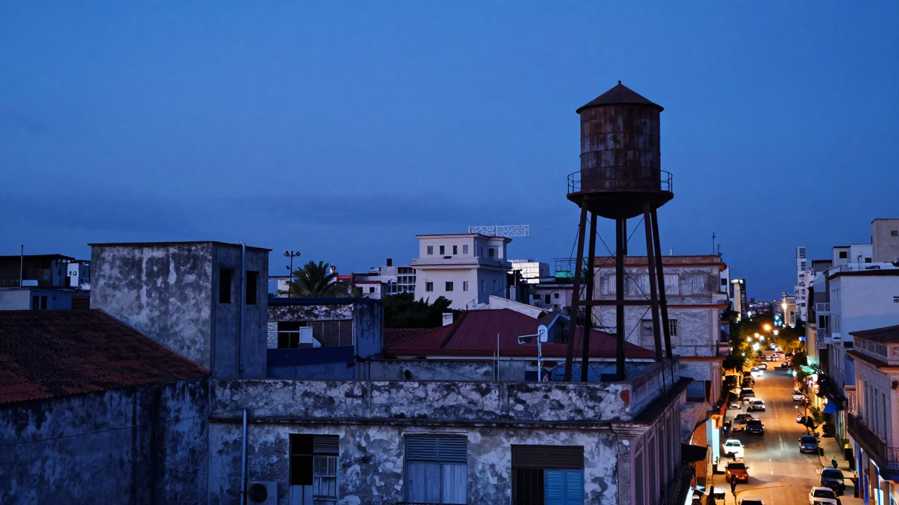 Blue Hour Havana Rooftop Scene with Water Tower and Street Life in in Havana, Cuba