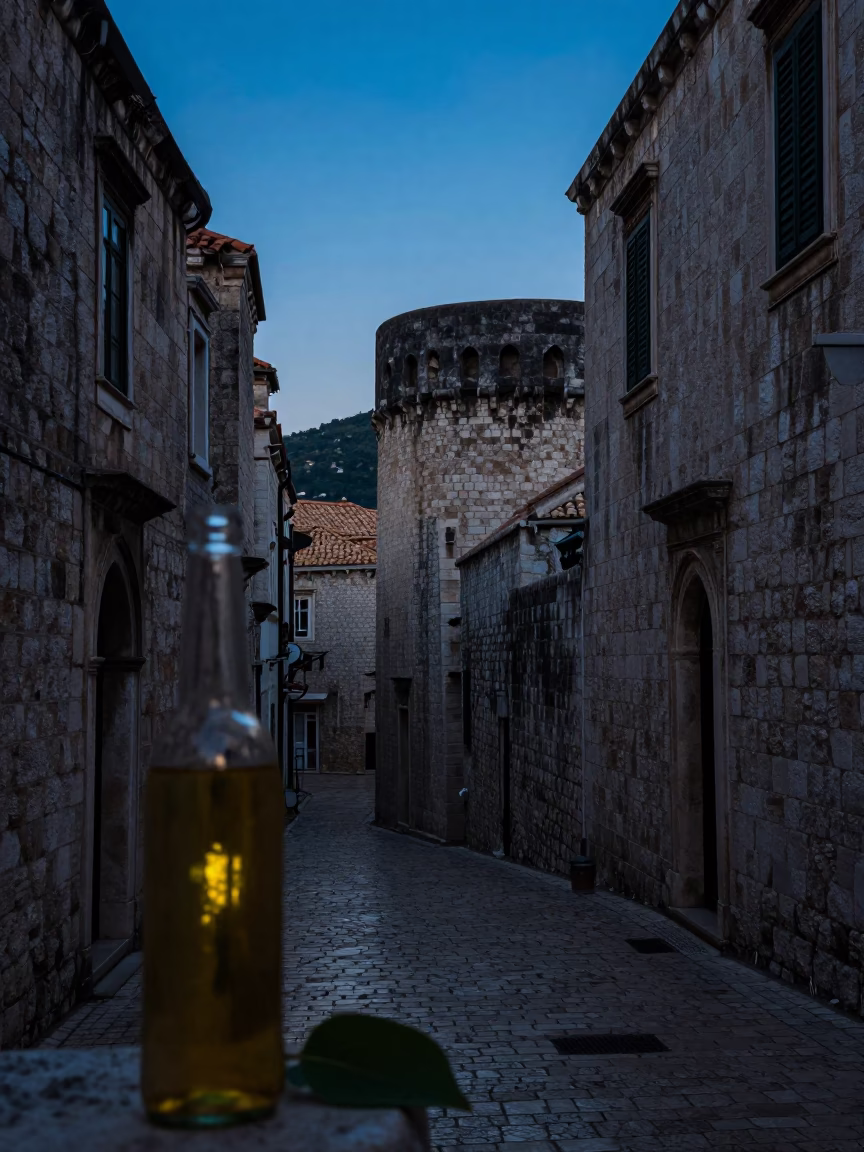 Blue Hour in Dubrovnik Croatia Street Scene with Colored Glass Bottle and Leaf Shadows in in Dubrovnik, Croatia