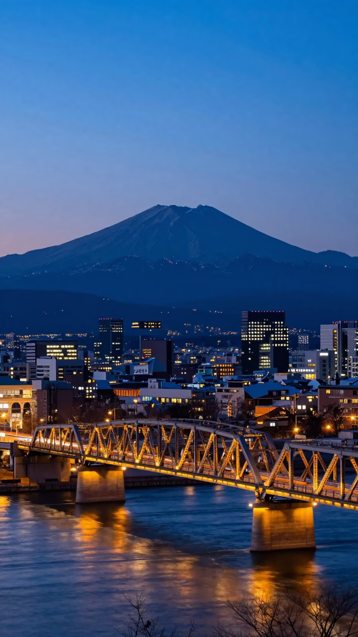 Blue Hour Landscape of Sapporo Japan Night Train Crossing Floodlit Iron Bridge 1960s Photography in in Sapporo, Japan