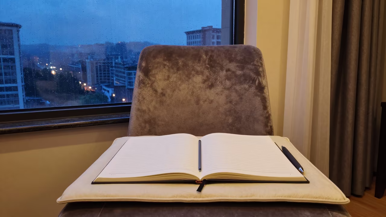 Blue Hour Ledger on Velvet Chair in on a velvet chair near Guiyang