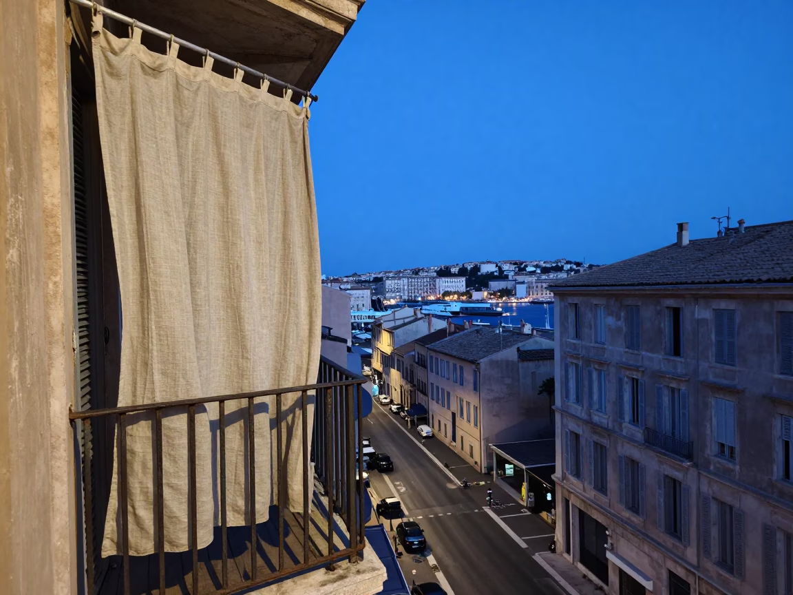 Blue Hour Marseille Street Scene with Linen Curtains and Urban Details in in Marseille, France