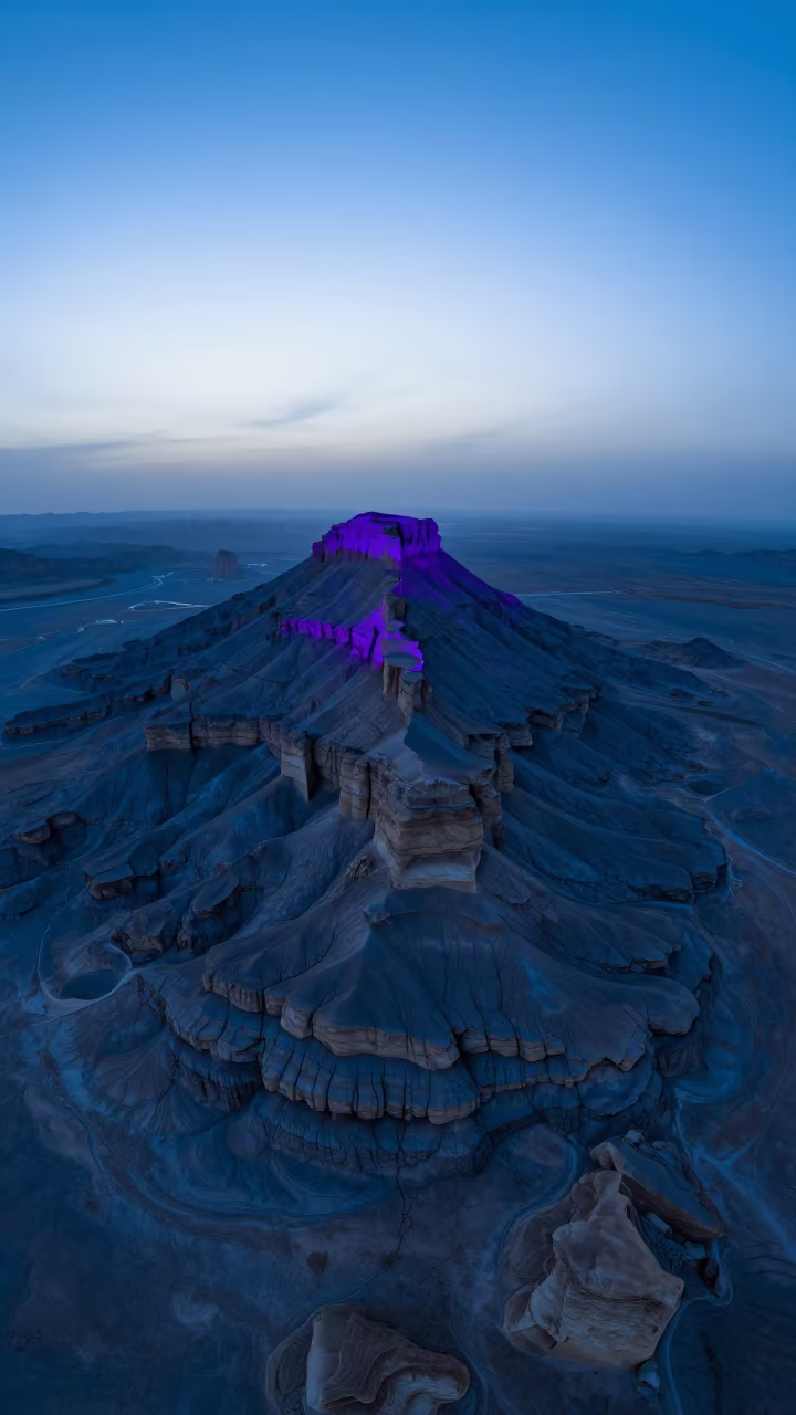 Blue Hour Mesa Rising From Flat Iranian Desert in in Iran