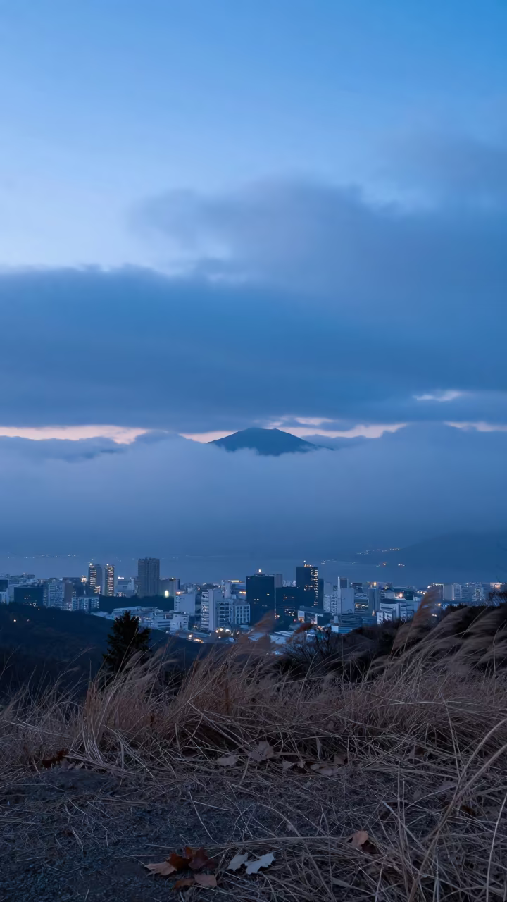 Blue Hour Mirage City Kyushu Horizon in beneath fast-moving cloud bands in Kyushu