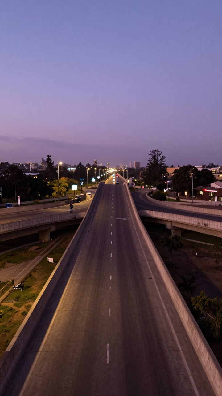 Blue Hour Nairobi Overpass Ramp Slicing Violet Sky with City Lights Below in in Nairobi, Kenya