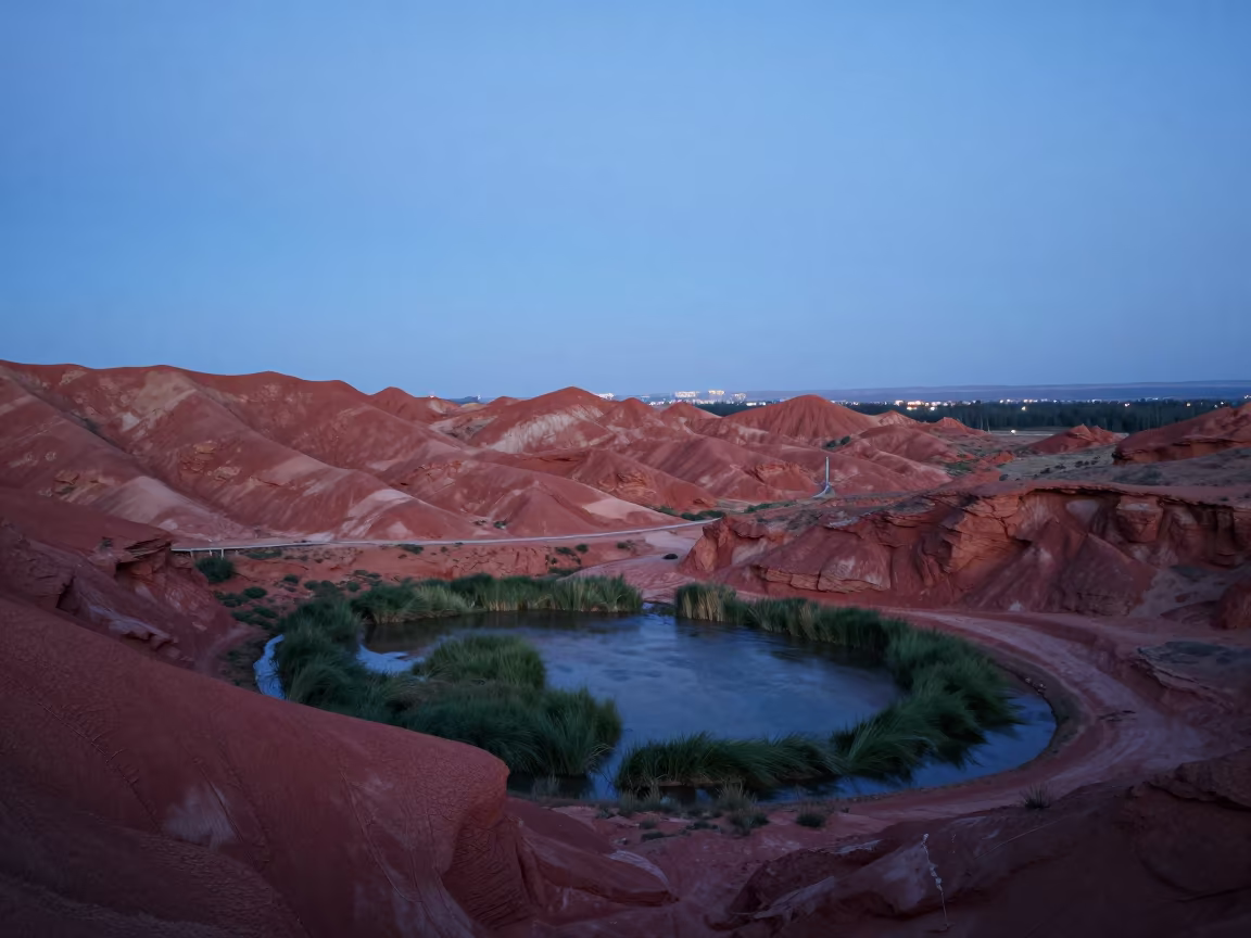 Blue Hour Oasis in Mongolian Red Canyon Ridge in from a ridge above layered foothills in Mongolia