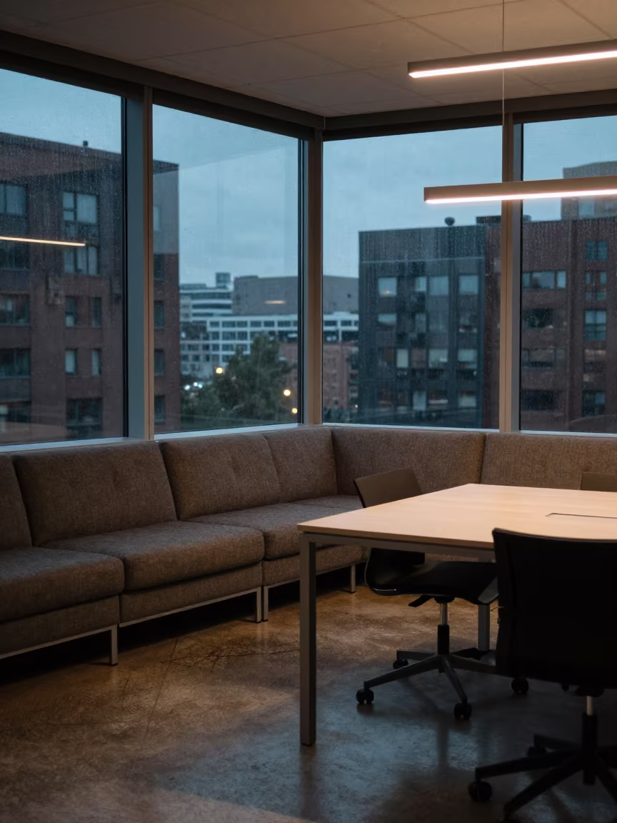 Blue Hour Office Bay With City View in at a boardroom table before a meeting near Araure