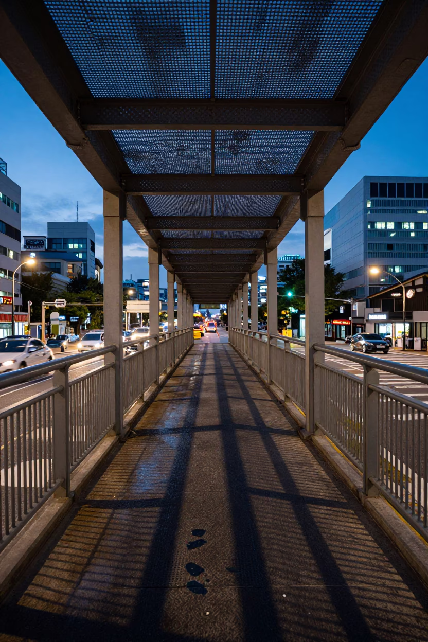 Blue Hour Pedestrian Overpass in Seoul with Perforated Metal and Wet Footsteps in in Seoul, South Korea