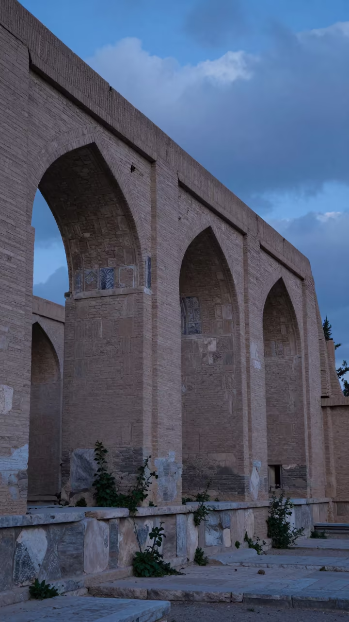 Blue Hour Ruins Uzbekistan Archway Weeds in among roofless stone chambers in Uzbekistan