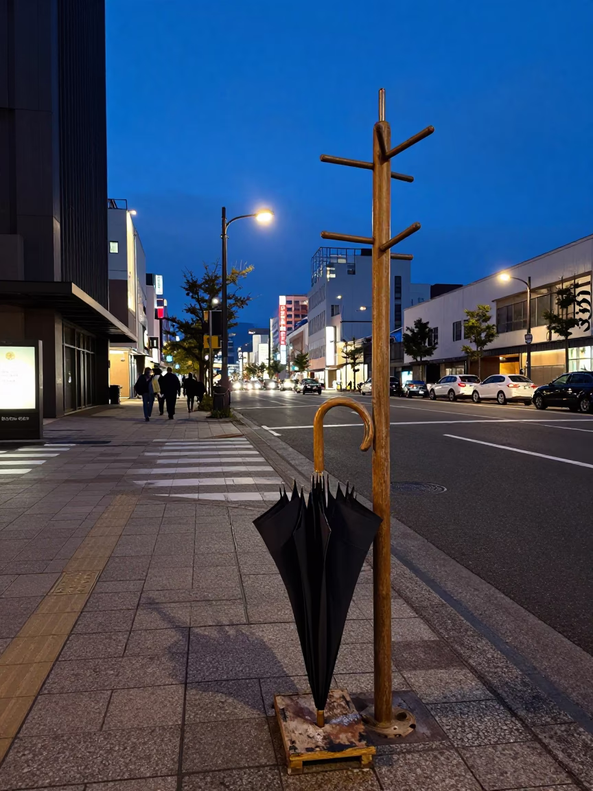 Blue Hour Sapporo Street Scene with Umbrella Stand and Coat Rack Outside Traditional Shop in in Sapporo, Japan