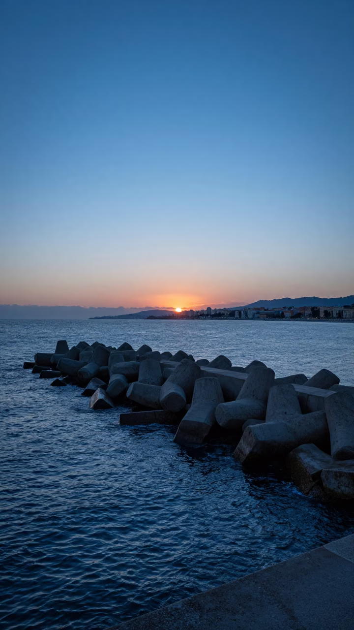 Blue Hour Sky Over Nice Harbor Breakwater and Mediterranean Coastline in in Nice, France