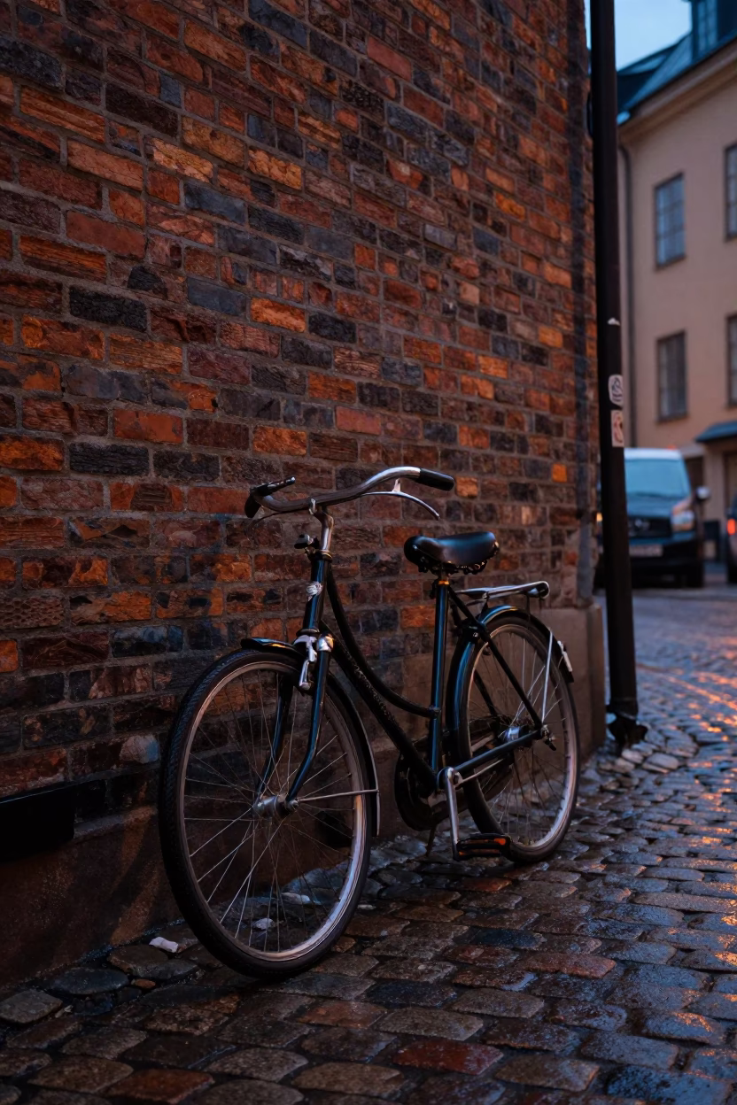 Blue Hour Stockholm Street Scene Vintage Bicycle Against Brick Wall in in Stockholm, Sweden