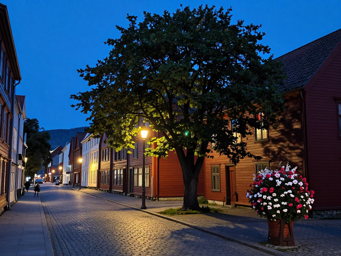 Blue Hour Street Scene in Bergen Norway with Tree and Flowering Plant in in Bergen, Norway