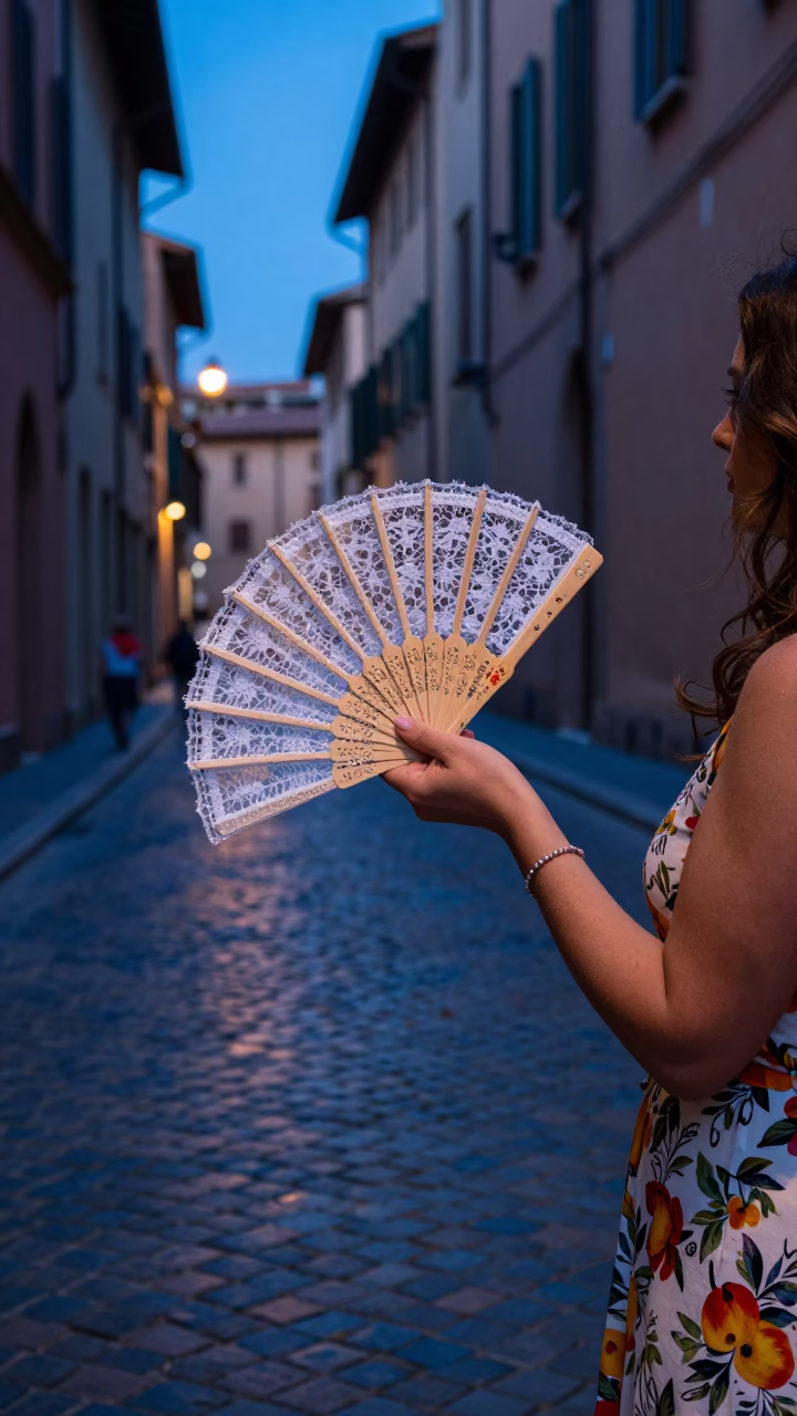 Blue Hour Street Scene in Bologna Italy with Folding Fan and Nectarines in in Bologna, Italy
