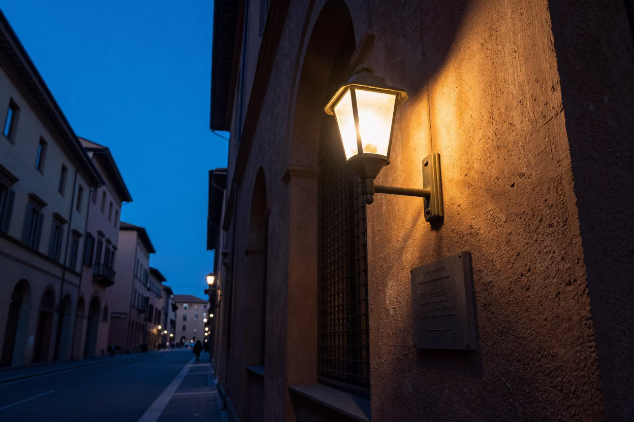 Blue Hour Street Scene in Bologna Italy with Wall Sconce and Concrete University Building in in Bologna, Italy