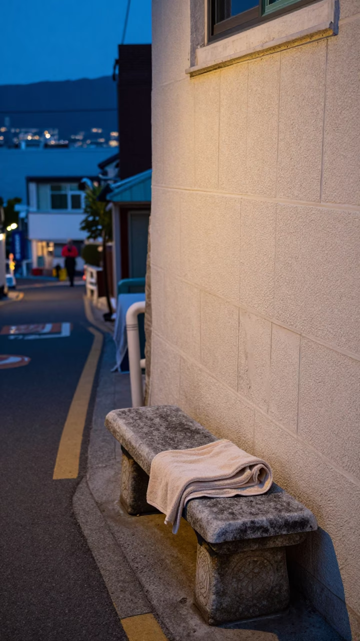 Blue hour street scene in Busan with stone bench and drying towels in in Busan, South Korea