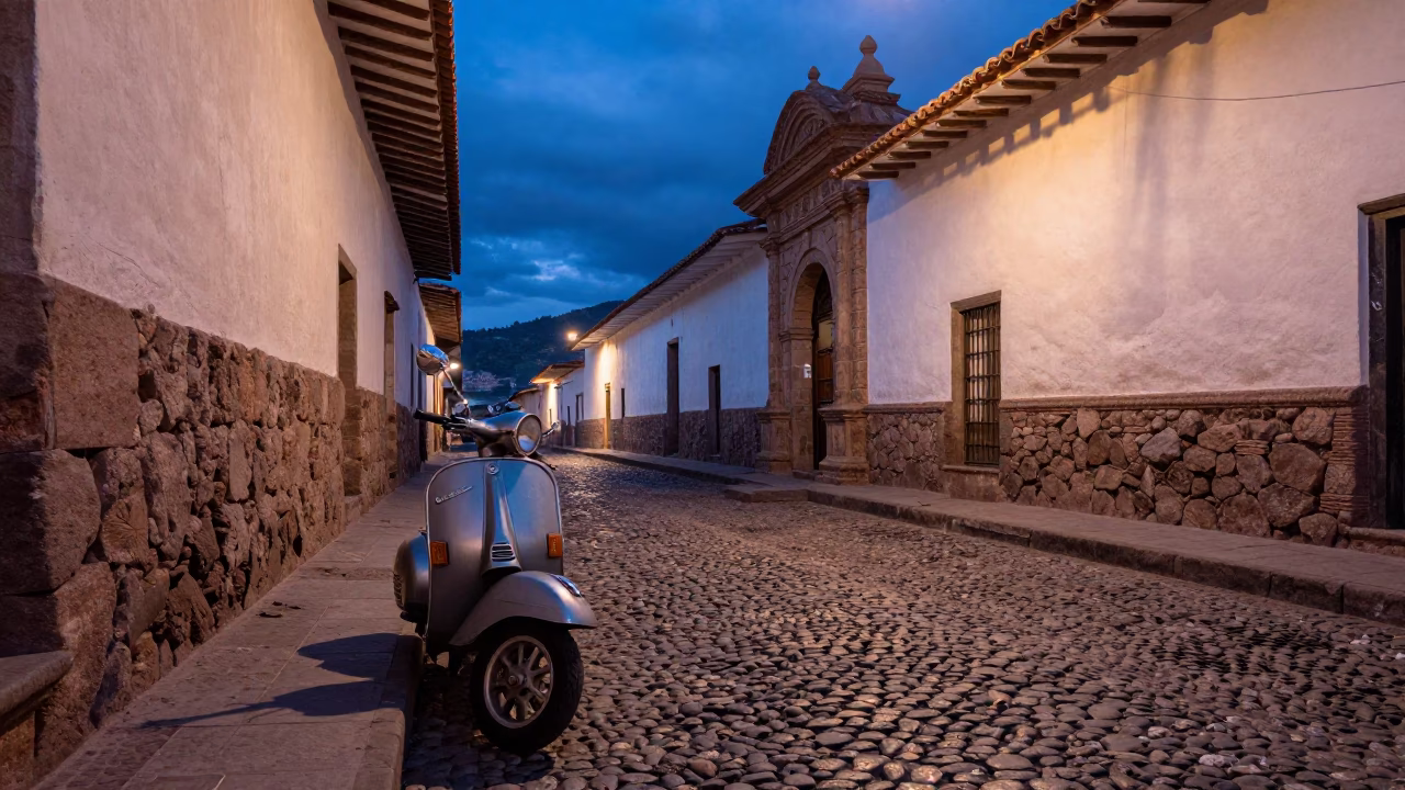 Blue Hour Street Scene in Cusco Peru with Vintage Vespa on Cobblestone in in Cusco, Peru