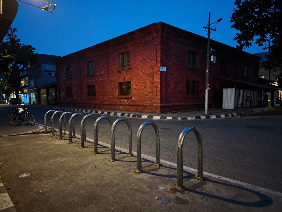 Blue Hour Street Scene in Kolkata India with Bicycle Rack and Red Brick Building in in Kolkata, India