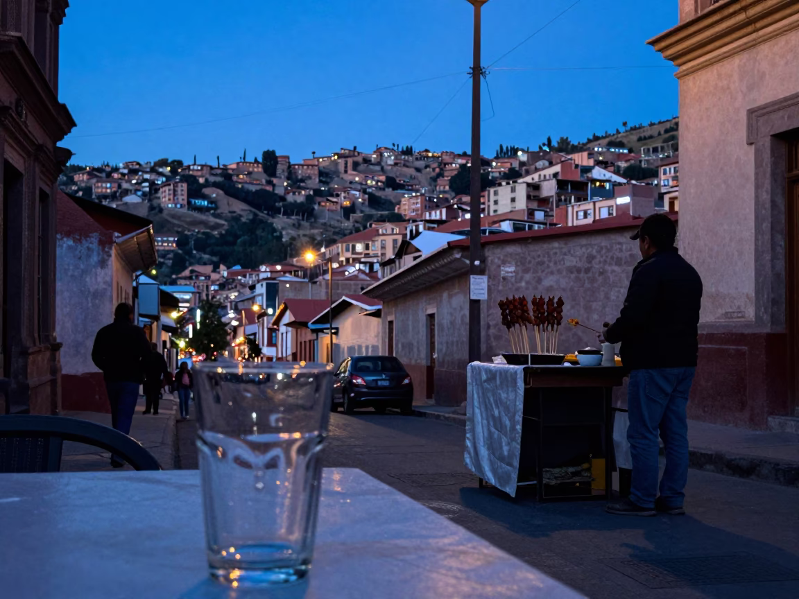Blue Hour Street Scene in La Paz Bolivia with Glass Tumbler and Satay Skewers in in La Paz, Bolivia