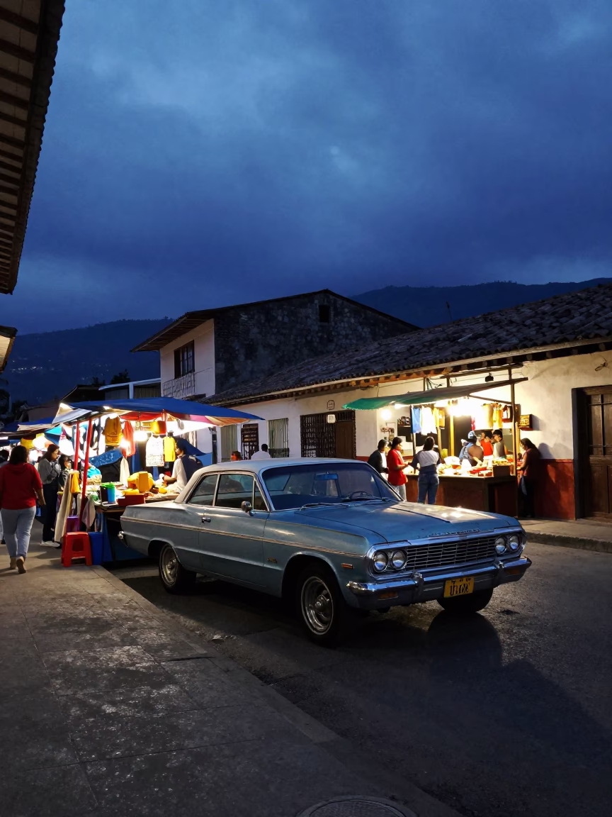 Blue Hour Street Scene in Medellin Colombia with Vintage Car and Local Market Activity in in Medellin, Colombia