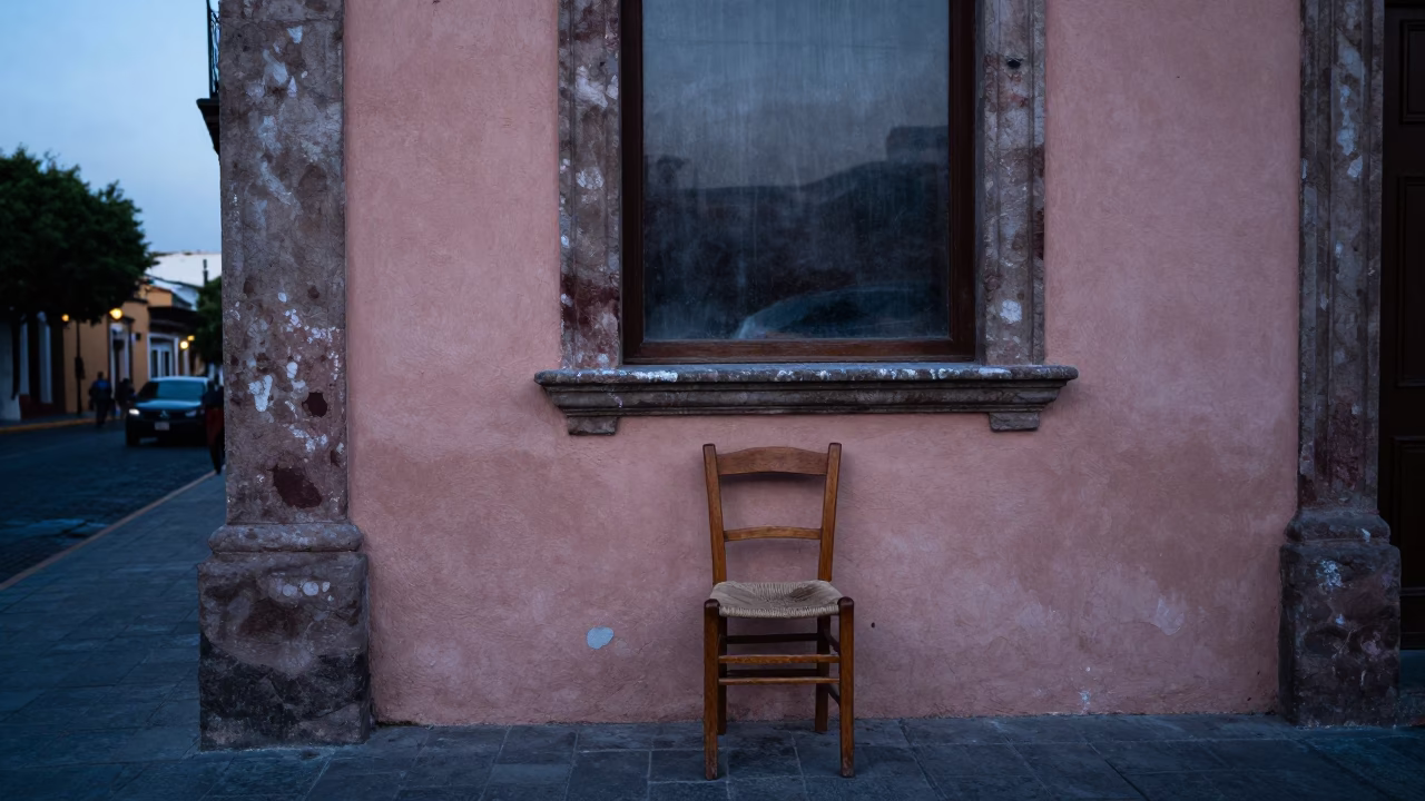 Blue Hour Street Scene in Mexico City with Wooden Chair and Smudged Window Sill in in Mexico City, Mexico