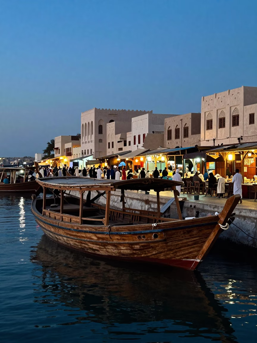 Blue Hour Street Scene in Muscat Oman With Wooden Dhow and Traditional Market Activity in in Muscat, Oman