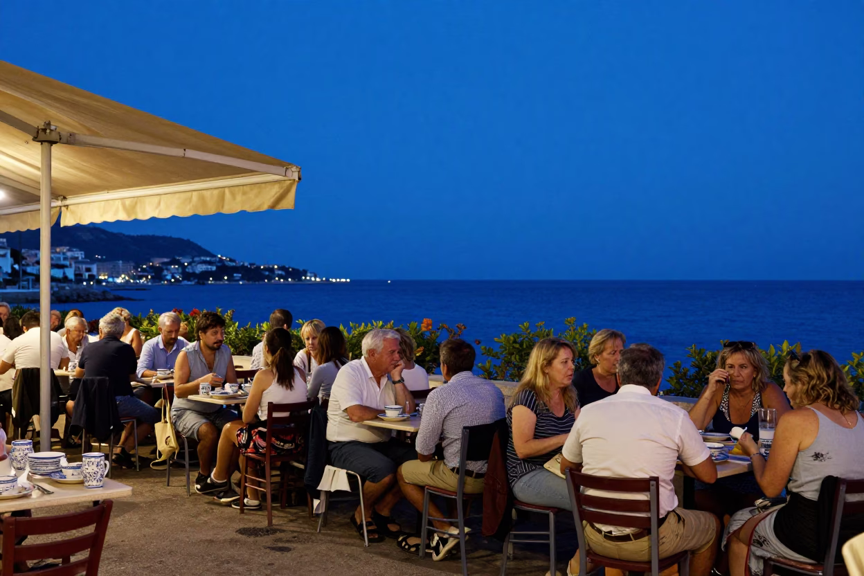 Blue Hour Street Scene in Nice France with Local Diners and Ceramic Dishes in in Nice, France