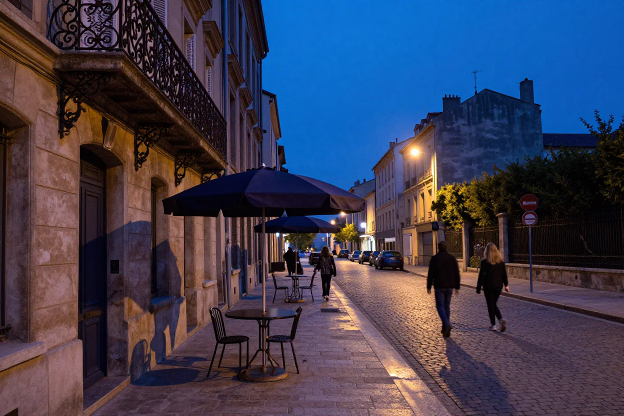 Blue Hour Street Scene in Nice France with Umbrella Stand and Evening Pedestrians in in Nice, France
