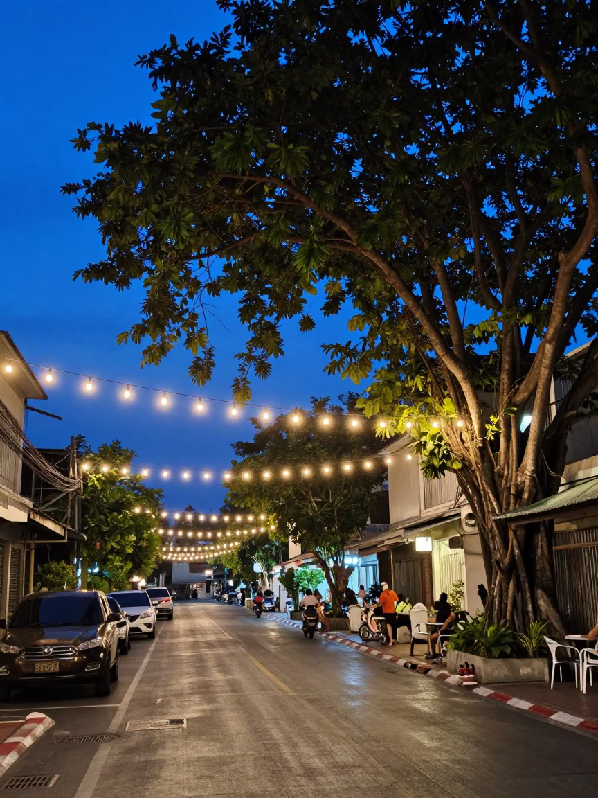 Blue Hour Street Scene in Phuket Thailand with String Lights and Banyan Tree in in Phuket, Thailand