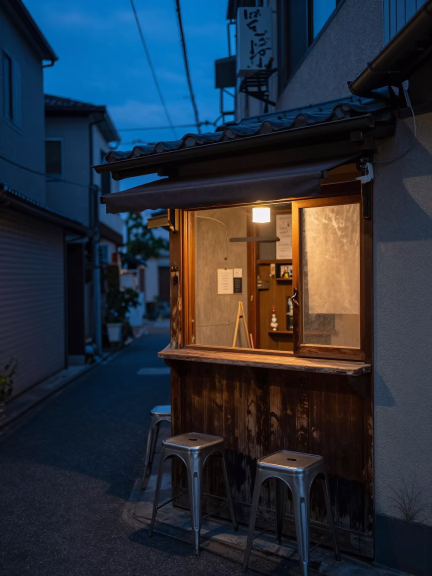 Blue Hour Tokyo Alleyway with Wooden Counter and Metal Stools in in Tokyo, Japan