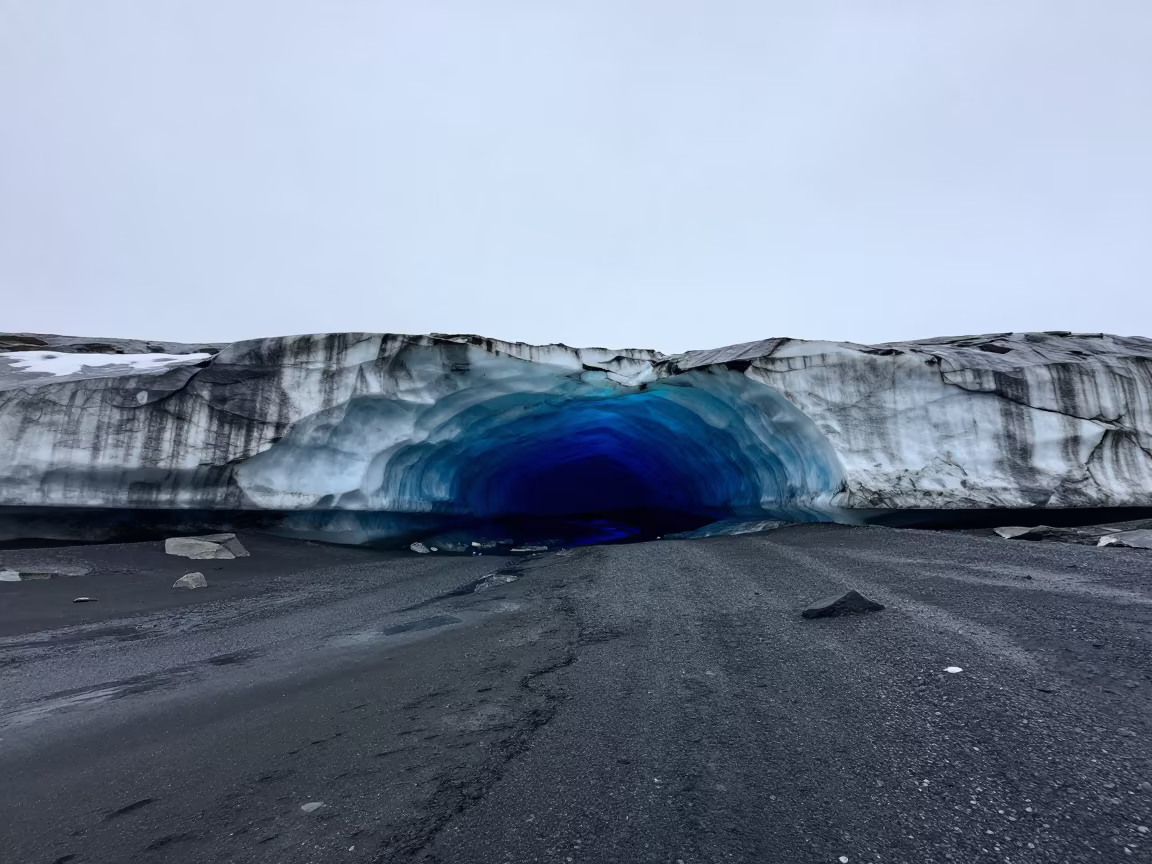 Blue Ice Cave Glowing on Canadian Shore in along a wave-cut shoreline in Canada