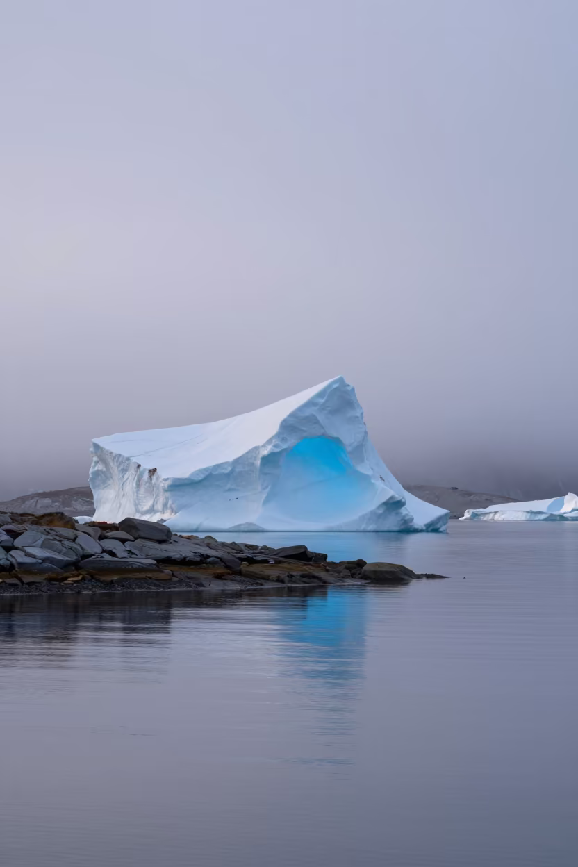 Blue Iceberg Arch Reflected in Misty Oslo Shore in along a wave-cut shoreline near Oslo