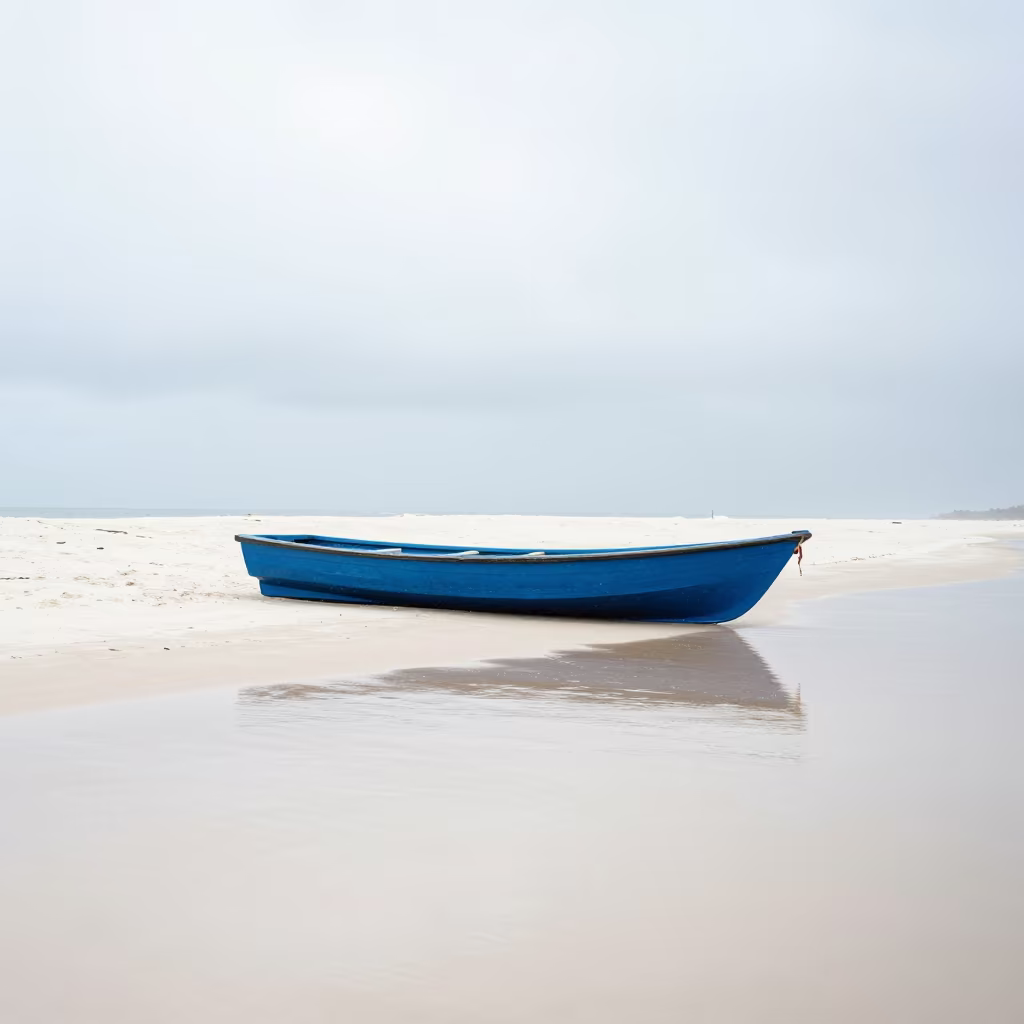 Blue Rowboat on White Sand Causeway Noon in on a wind-open causeway near Dar es Salaam