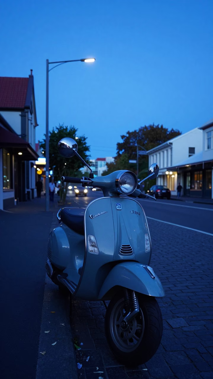 Blue Twilight Street Scene in Christchurch New Zealand With Vintage Vespa and Plumbago Hedge in in Christchurch, New Zealand