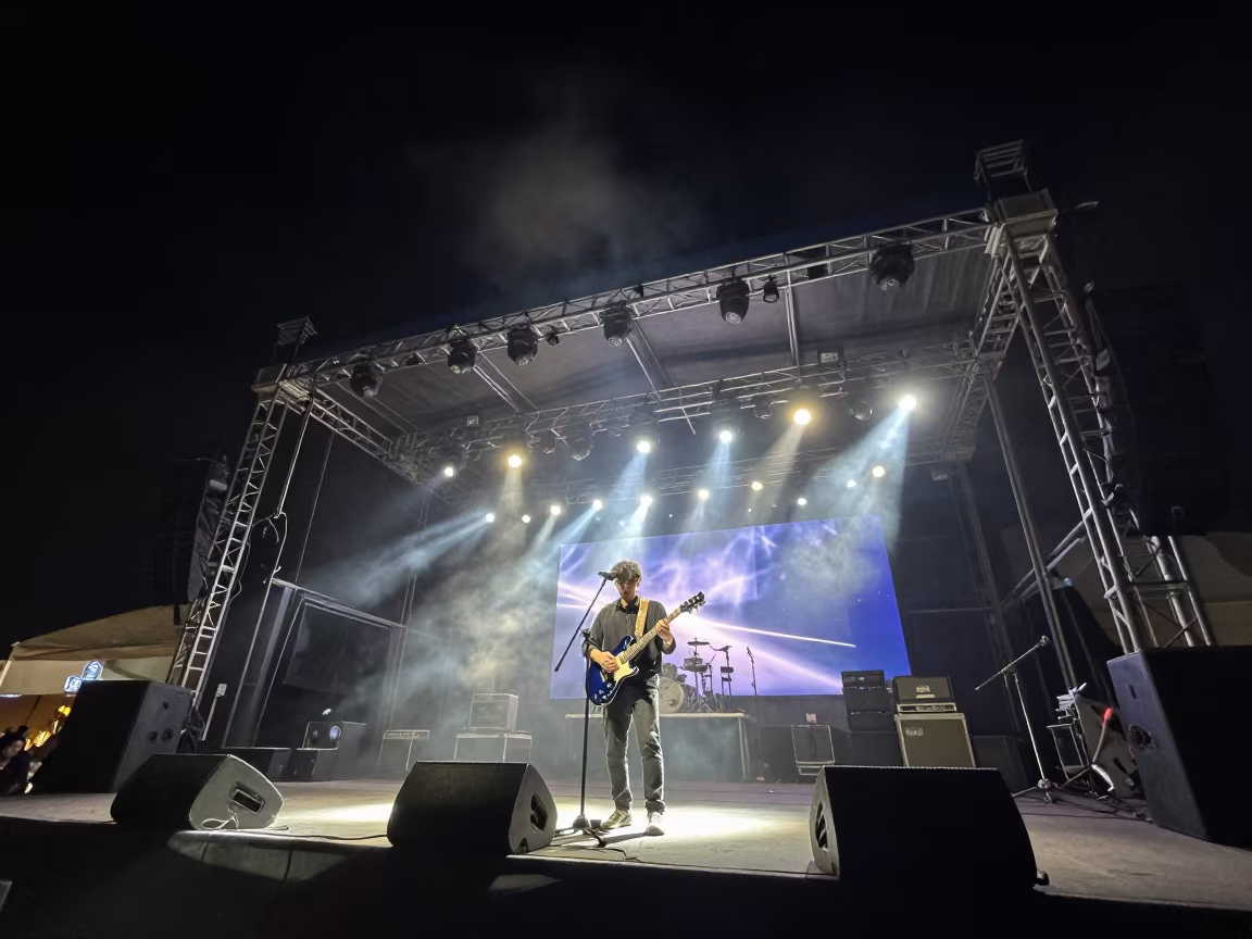 Blues Guitarist on Stage at Night in on a festival main stage in Menouf