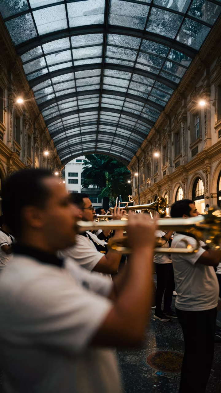 Blurred Marching Band Night Arcade in inside a glass-roofed arcade in Belo Horizonte