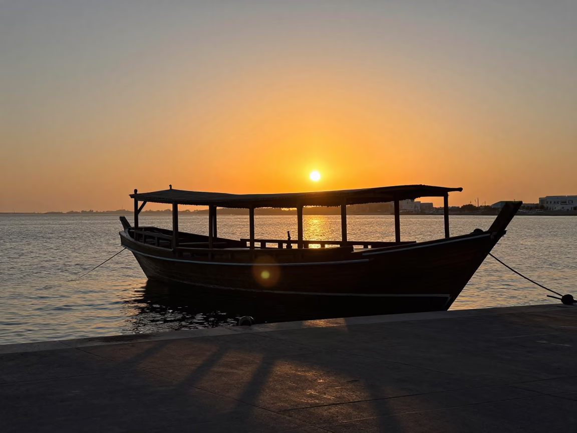 Boat Silhouette in Muscat at As The Sun Drops Toward The Horizon in in Muscat, Oman