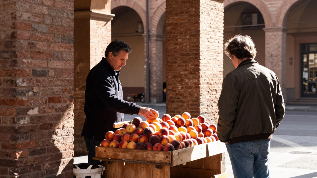 Bologna Italy early afternoon street scene with nectarines and local market interaction in in Bologna, Italy