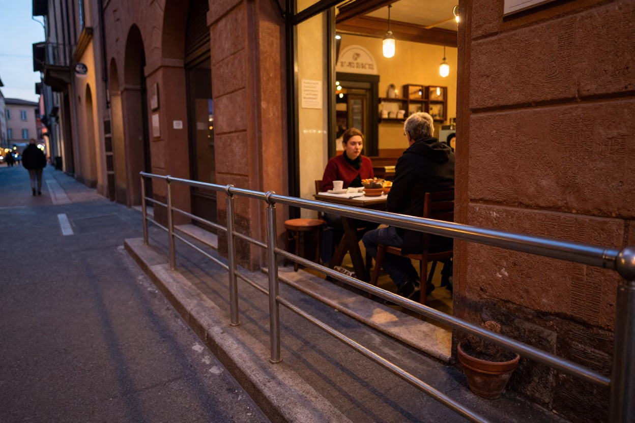 Bologna Italy Early Evening Street Scene with Terracotta Bowls and Brushed Steel Rail in in Bologna, Italy