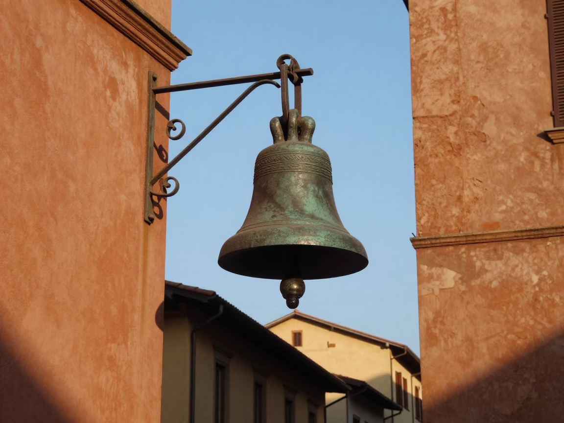 Bologna Italy Late Afternoon Street Scene with Bronze Bell and Mending Basket in in Bologna, Italy
